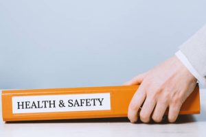 Health and safety labor protection and regulations at work place. Folder with documents or instructions. employees and their rights. Guidance or induction. Copy space